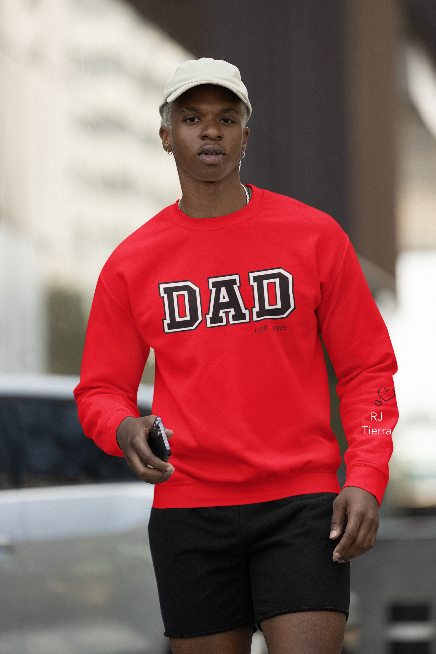 A gentleman in a red sweatshirt that read " DAD est 1979"