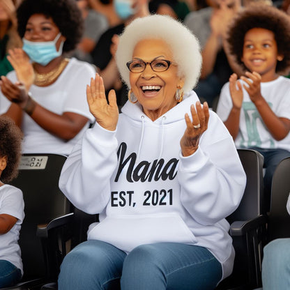 Grandmother with a sweatshirt that read " Nana est. 2021"
