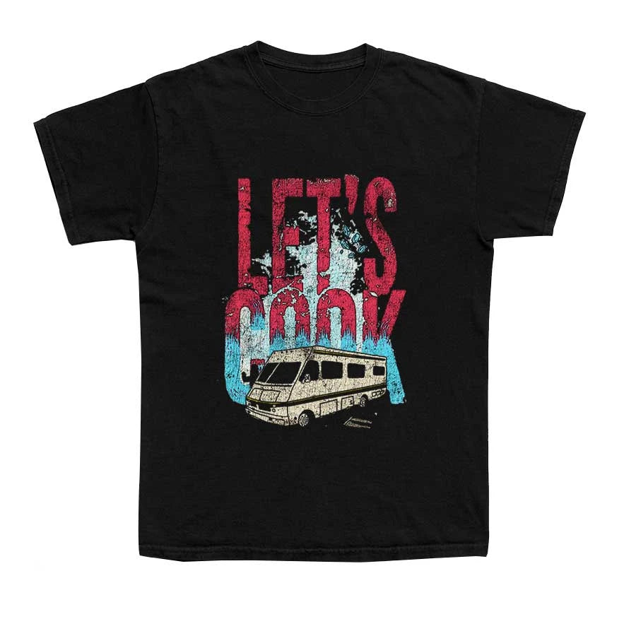 A black T Shirt with the words "Let's Cook" and a drawing of an RV