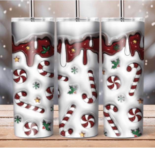 3 Tumblers with candy canes and snow on them.