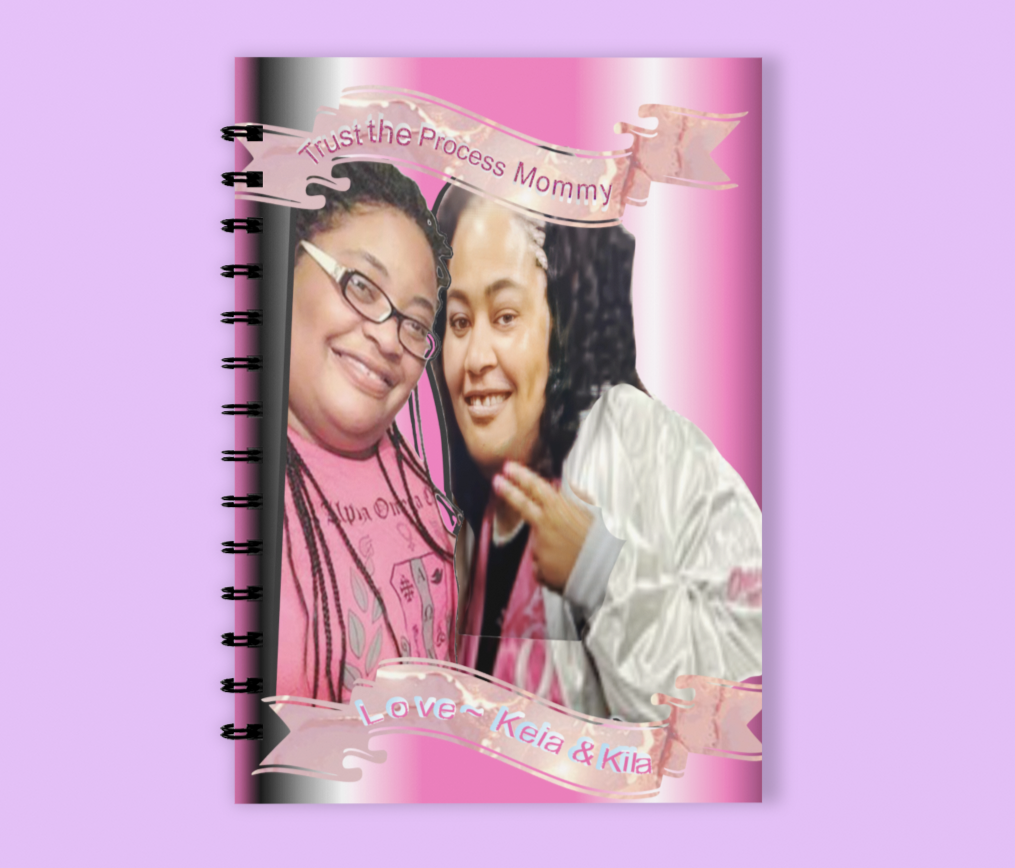 Wired notebook with the picture of beautiful adult twins pledging their sorority. 
