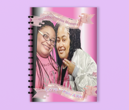 Wired notebook with the picture of beautiful adult twins pledging their sorority. 