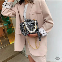 Load image into Gallery viewer, Leather Jacket style purse black with white polka dots. Pearl chain handle