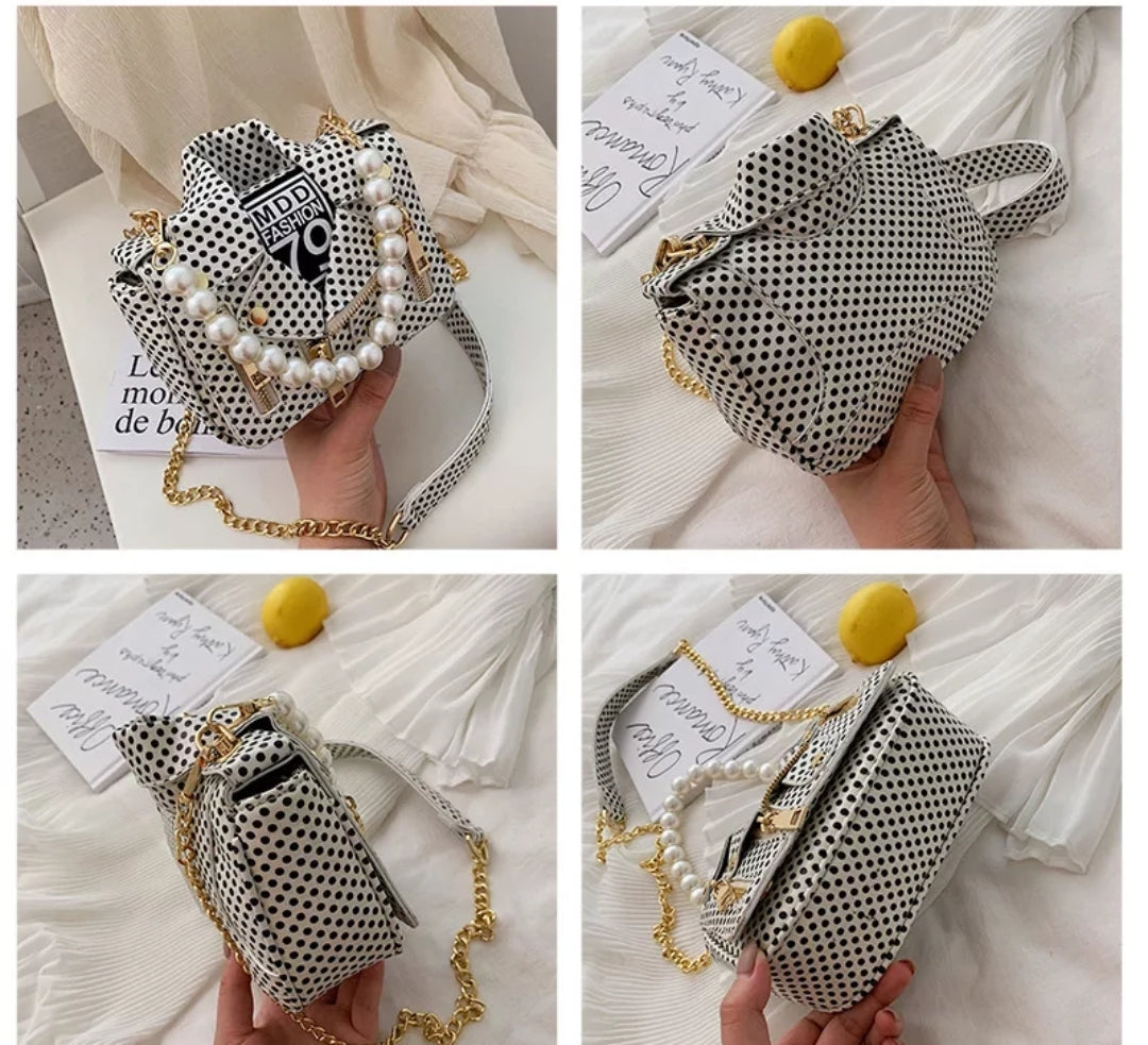 Leather Jacket style purse white with Black polka dots. Pearl chain handle