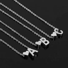 Load image into Gallery viewer, silver colored necklace with heart and letter initial charm