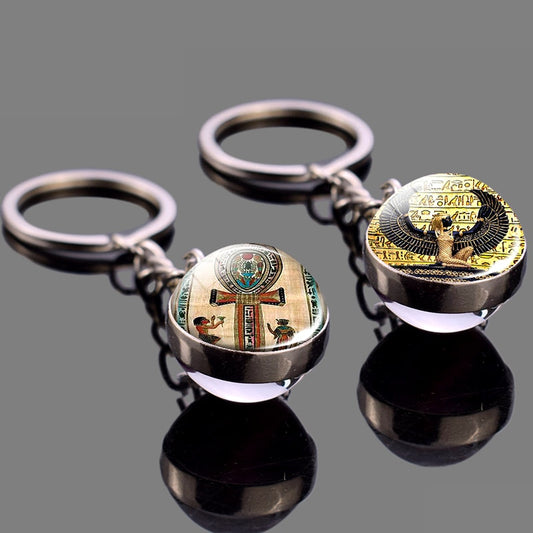 2 Glass ball keychains with Egyptian art.