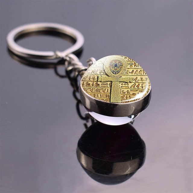 Glass ball keychain with Egyptian art. Ankh