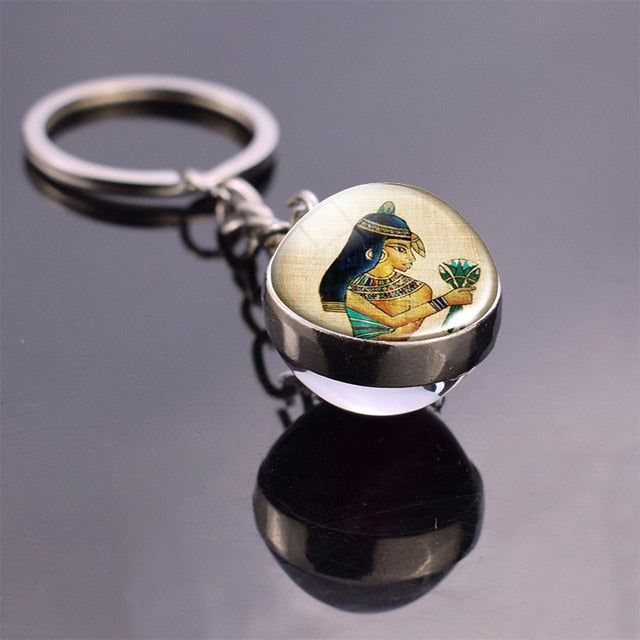  Glass ball keychain with Egyptian art.